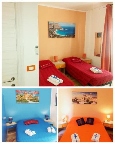 A cozy hotel room collage featuring vibrant orange, blue, and red bedding with scenic wall art, ideal for travelers seeking comfort and color in budget-friendly accommodations.
