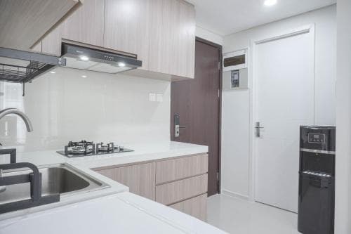 Nice and New 1BR with Office Room at Daan Mogot City Apartment By Travelio