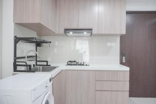 Nice and New 1BR with Office Room at Daan Mogot City Apartment By Travelio