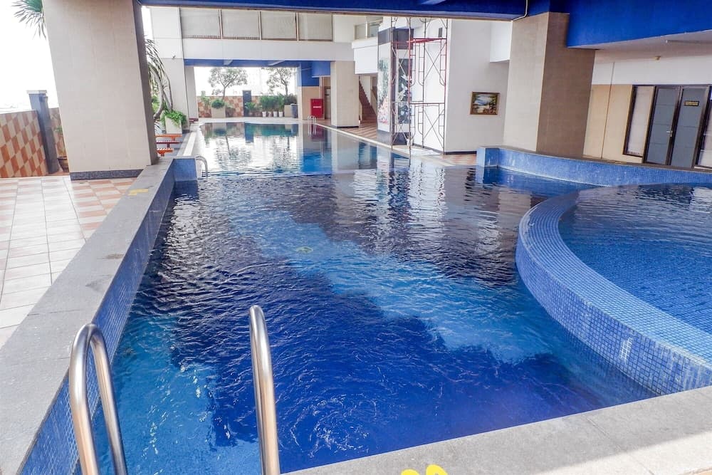 Spacious and Homey 2BR Mangga Dua Apartment By Travelio