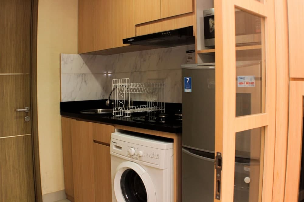 Comfort Studio Room at Oasis Cikarang Apartment By Travelio