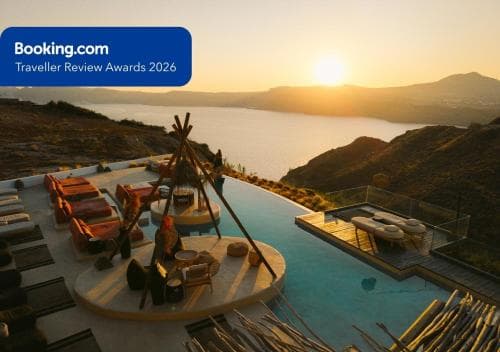 A serene sunset illuminates a luxurious rooftop terrace with an infinity pool, cozy seating areas, and panoramic sea views, ideal for travelers seeking relaxation and romance.