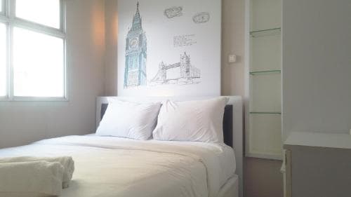 Cozy and Spacious 2BR at Suites @Metro Apartment By Travelio