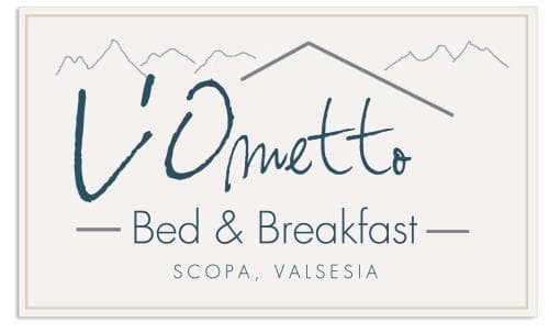 A serene mountain-themed logo for L'Ometto Bed & Breakfast in Scopa, Valsesia, evokes a cozy retreat with its charming design, perfect for travelers seeking a peaceful getaway.