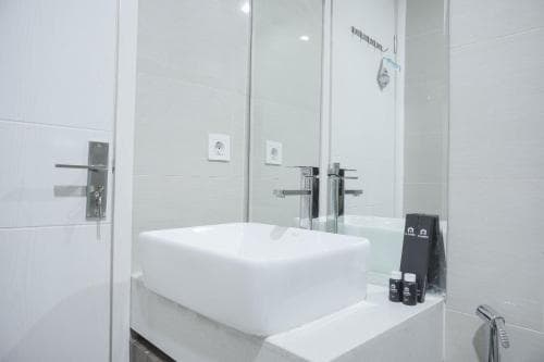 Nice and New 1BR with Office Room at Daan Mogot City Apartment By Travelio