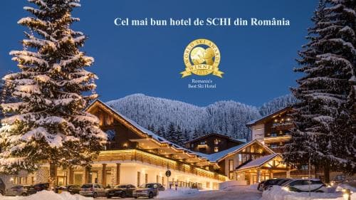 A cozy ski resort illuminated at dusk with snow-covered trees and mountains in the background, ideal for winter sports enthusiasts seeking luxury accommodations.