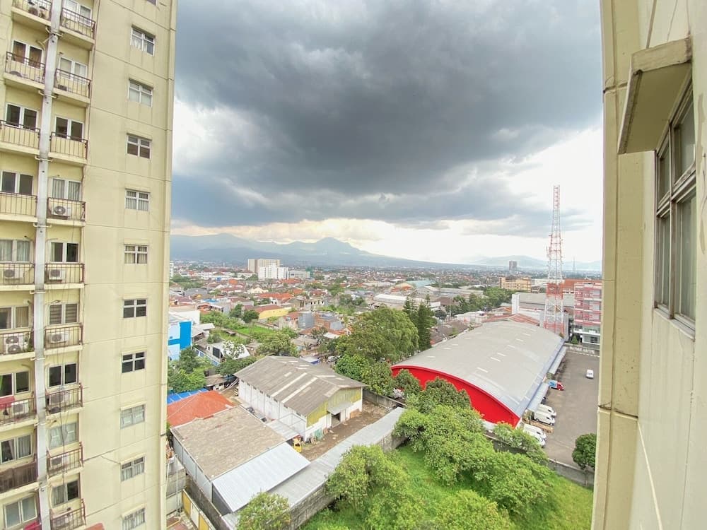 Cozy and Spacious 2BR at Suites @Metro Apartment By Travelio