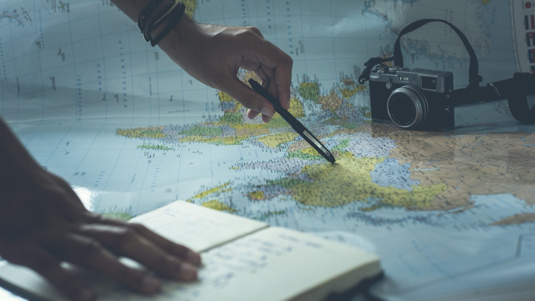 Trip Planner AI review image of a traveler comparing routes on a map