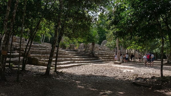 Coba ruins stone structures beneath the Yucatan jungle canopy