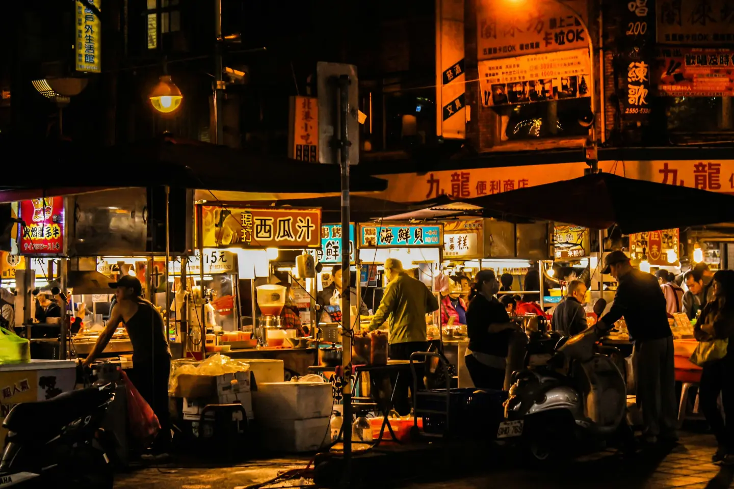 Food stalls and shoppers at a busy night market